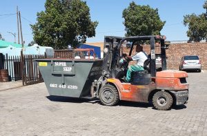 skip bin and forklift
